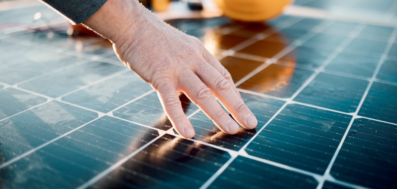 Hands, engineer and solar panel in construction for renewable en Hands, engineer and solar panel in construction for renewable en